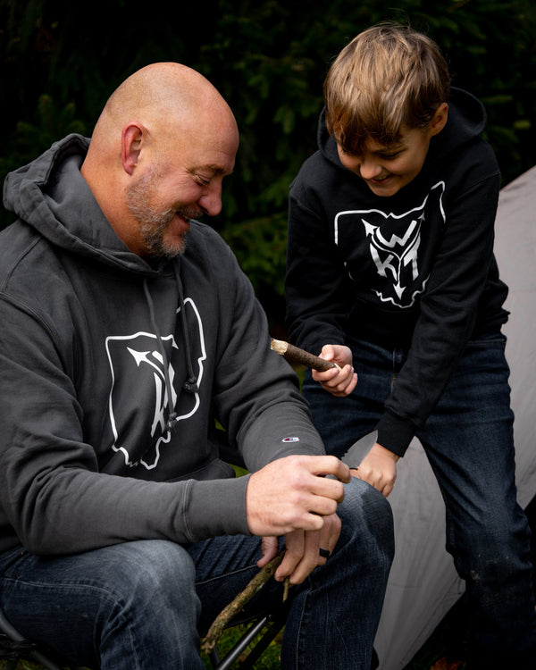 man and boy at campsite