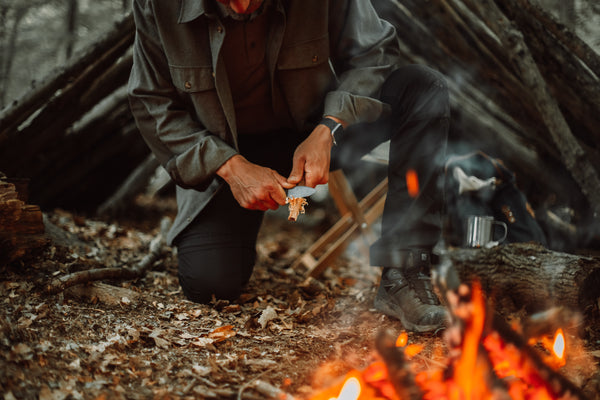 man with eddy 2 at a campsite